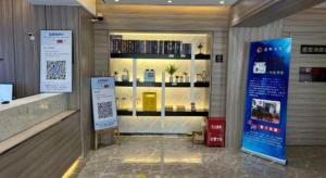 a lobby of a building with a store window with books at Starway Hotel (xiamen zhongshan road) in Xiamen