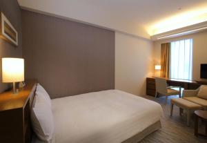 Postel nebo postele na pokoji v ubytování Odakyu Hotel Century Sagami Ono