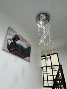 a shower with water coming out of a ceiling at Villa Witroos luxury and elegance in Yaoundé