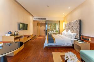 Télévision ou salle de divertissement dans l'établissement Echeng Hotel Liuzhou Central Plaza Pedestrian Street