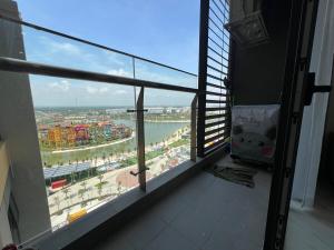 a room with a window with a view of a harbor at VINHOMES GRAND PARK Chillin Home 1BR Best View in Long Bình
