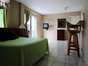 Postel nebo postele na pokoji v ubytování Curacao Lodge