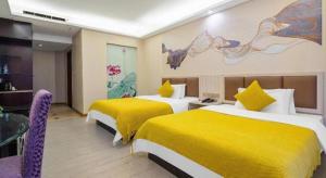 Postel nebo postele na pokoji v ubytování Oriental Hotel