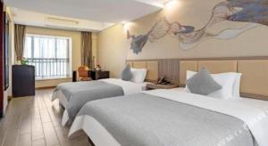 Postel nebo postele na pokoji v ubytování Oriental Hotel