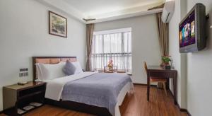 Postel nebo postele na pokoji v ubytování Oriental Hotel