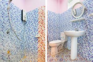 Koupelna v ubytování OYO 749 Baan Suan Resort