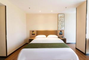 Ένα ή περισσότερα κρεβάτια σε δωμάτιο στο GreenTree Inn Lu'an Jin'an District Yuanda Xingfuli