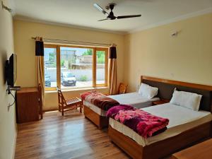 Ένα ή περισσότερα κρεβάτια σε δωμάτιο στο Sixteen Arahat guest house