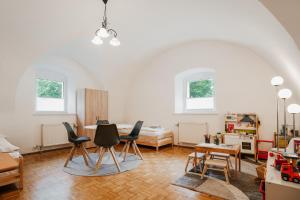 a living room with chairs and a table at NaturparkResort Almmauer in Landl