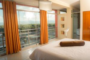 เตียงในห้องที่ Hotel San Marino - Tarapoto
