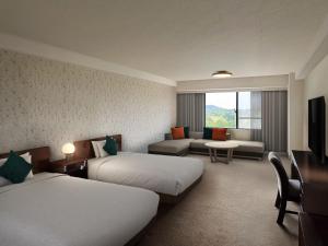 The Pulse Kirishima- Opening in 16th Aug 2025客房内的一张或多张床位