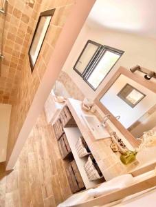an overhead view of a bathroom with a sink at La grange des amoureux piscine jacuzzi et massages in Le Beausset
