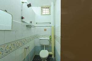 Koupelna v ubytování OYO 90522 Alma Sweet Home