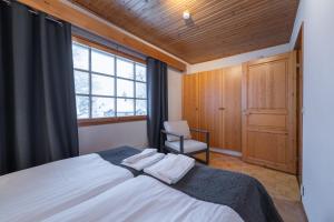 Postel nebo postele na pokoji v ubytování Kuukkeli Apartments Teerenpesue E 33