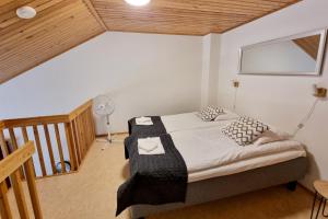 Postel nebo postele na pokoji v ubytování Kuukkeli Apartments Teerenpesue E 33
