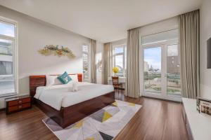 Ένα ή περισσότερα κρεβάτια σε δωμάτιο στο Khanh Villa Phuoc Truong 2 - Venuestay +42 φωτογραφίες