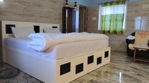 Postel nebo postele na pokoji v ubytování Okaasan Guest House