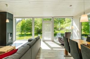 a living room with a couch and a table at 4 Personen mit Sauna F0H4 in Ruhla