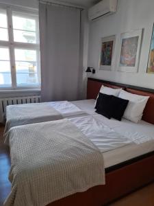 Postel nebo postele na pokoji v ubytování Rooms Bytom