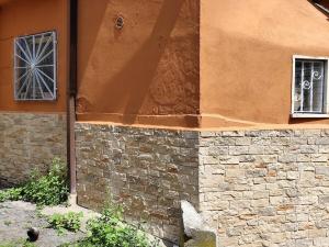 a building with a window and a brick wall at Suite Villa Livia in Rome