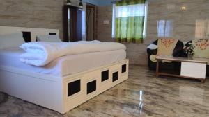 Postel nebo postele na pokoji v ubytování Okaasan Guest House