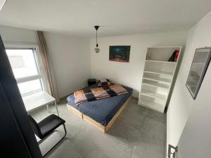 Postel nebo postele na pokoji v ubytování Gambarogno Locarno - Modern and Comfortable