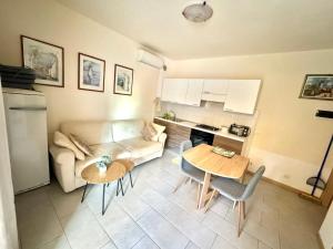 a living room with a couch and a table at Apartments ENA near Rovinj in Šorići