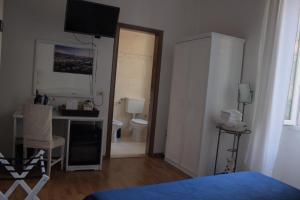 Posteľ alebo postele v izbe v ubytovaní Soggiorno Madrid