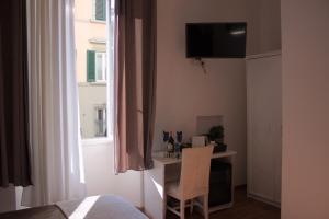 TV a/nebo společenská místnost v ubytování Soggiorno Madrid
