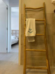 a towel hanging on a towel rack in a bathroom at La Savina Ses Platgetes in La Savina +38 photos