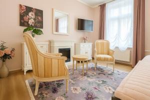 Μια τηλεόραση ή/και κέντρο ψυχαγωγίας στο N&N Apartments - Stadt & Schlossblick mit eigenem Garten