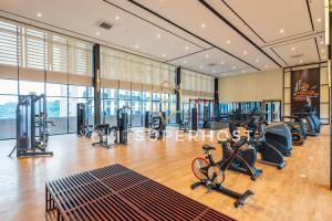 a gym with treadmills and exercise equipment in a building at Paxtonz by YourSuperhost in Kuala Lumpur