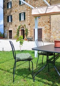 a table and chairs in front of a building at La Casa del Belvedere in Perugia