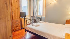 Postel nebo postele na pokoji v ubytování La Finestra sul Lago - Italian Homing