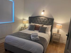 Кровать или кровати в номере Fox s Rest - 4 Bedroom House