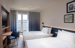 Hampton By Hilton Potsdam Babelsberg客房内的一张或多张床位