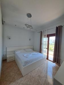 A bed or beds in a room at Olmar's Guest House