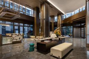Zona de estar de 上海虹桥荷逸唐酒店北新泾地铁站Shanghai Hongqiao Heyitang Hotel Beixinjing Subway Station Branch