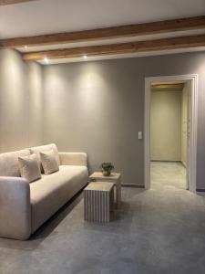 a living room with a couch and a table at Apartment with backyard in Copenhagen