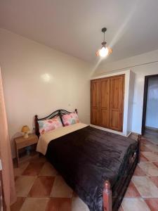 a bedroom with a large bed in a room at un vrai repos in Essaouira