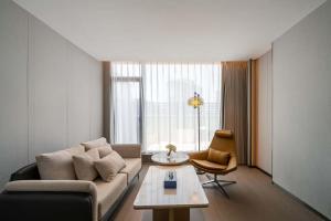 Zona de estar de 上海虹桥荷逸唐酒店北新泾地铁站Shanghai Hongqiao Heyitang Hotel Beixinjing Subway Station Branch