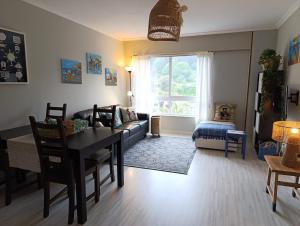 a living room with a couch and a table at Marusia in Viveiro