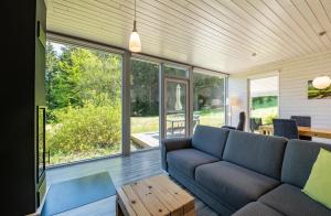 a living room with a couch and a table at 2 Personen mit Sauna F3H7 in Ruhla