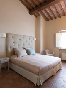 Postel nebo postele na pokoji v ubytování Resort Casale Le Torri