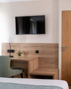 TV a/nebo společenská místnost v ubytování Hotel Grand Villa Suite Near IGI Airport + 25 fotografií
