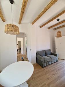 a living room with a couch and a table at Mammì in Balestrate