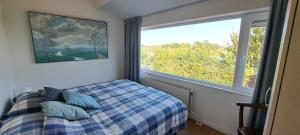 Postel nebo postele na pokoji v ubytování Moderne woning direct aan het Veerse Meer, dichtbij Zeeuwse kust VP054