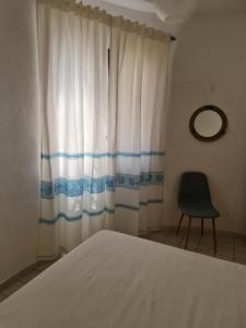 Giường trong phòng chung tại Villetta Baia Reparata