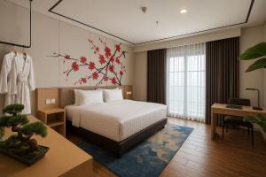 A bed or beds in a room at The Bellezza Hotel Suites