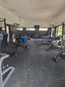 a gym with several treadmills and exercise bikes at paradise in Ballito in Ballito